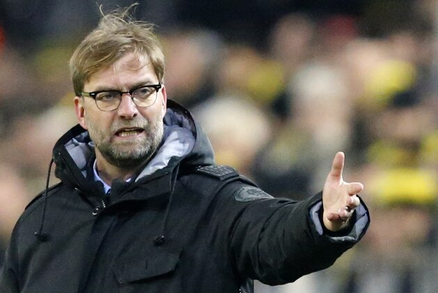 Dortmund's head coach Juergen Klopp gestures during the Group D Champions League soccer match between Dortmund and Anderlecht in Dortmund, Germany, Tuesday Dec. 9, 2014. (AP Photo/Frank Augstein)