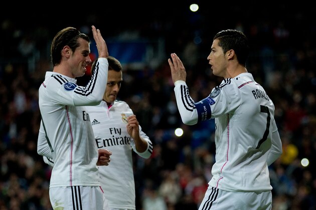 MADRID, SPAIN - DECEMBER 09:  Cristiano Ronaldo (R) of Real Madrid CF celebrates scoring their opening goal with teammates Gareth Bale (L) and Javier Hernandez Chicharito (2ndL) during the UEFA Champions League Group B match between Real Madrid CF and PFC Ludogorets Razgrad at Estadio Santiago Bernabeu on December 9, 2014 in Madrid, Spain.  (Photo by Gonzalo Arroyo Moreno/Getty Images)