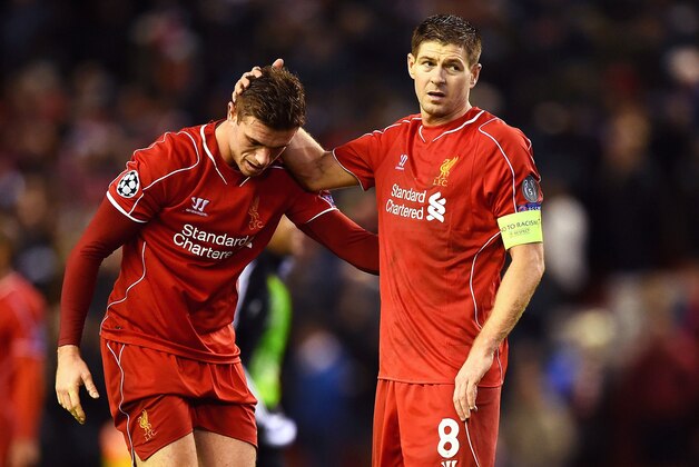 LIVERPOOL, ENGLAND - DECEMBER 09:  (L-R) Dejected Liverpool players Jordan Henderson and Steven Gerrard react following their team's 1-1 draw and exit from the competition during the UEFA Champions League group B match between Liverpool and FC Basel 1893 at Anfield on December 9, 2014 in Liverpool, United Kingdom.  (Photo by Laurence Griffiths/Getty Images)