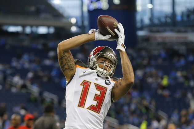 Tampa Bay Buccaneers wide receiver Mike Evans (13) runs through pre-game drills before an NFL football game against the Detroit Lions in Detroit, Sunday, Dec. 7, 2014. (AP Photo/Paul Sancya)