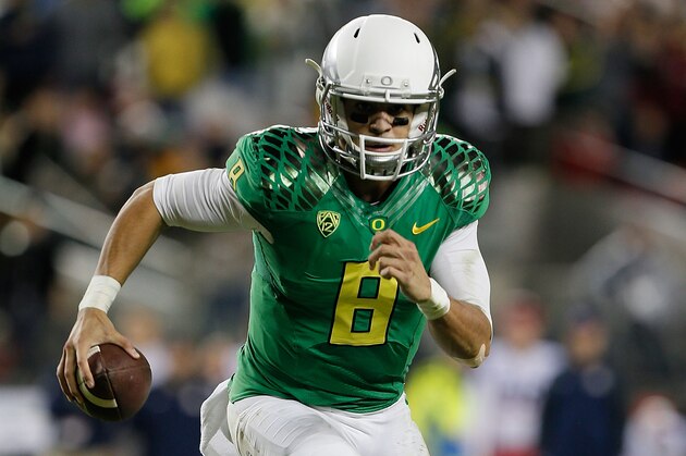 SANTA CLARA, CA - DECEMBER 05: Marcus Mariota #8 of the Oregon Ducks scrambles for a touchdown against the Arizona Wildcats during the first half of the PAC-12 Championships at Levi's Stadium on December 5, 2014 in Santa Clara, California. (Photo by Brian Bahr/Getty Images)