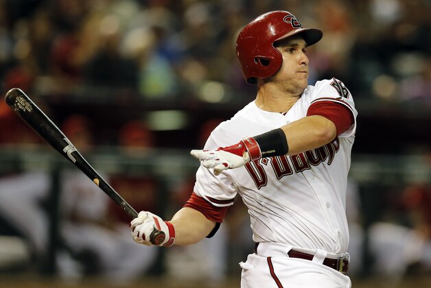 Sep 26, 2014; Phoenix, AZ, USA; Arizona Diamondbacks catcher Miguel Montero (26) singles against the St. Louis Cardinals in the first inning at Chase Field. Mandatory Credit: Rick Scuteri-USA TODAY Sports