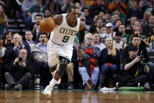 Boston Celtics guard Rajon Rondo (9) dribbles the ball up court during the second half of an NBA basketball game against the Detroit Pistons in Boston, Wednesday, Dec. 3, 2014. (AP Photo/Elise Amendola)
