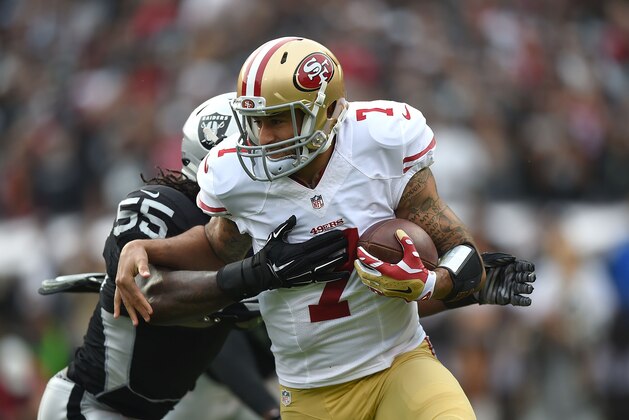 OAKLAND, CA - DECEMBER 07:  Colin Kaepernick #7 of the San Francisco 49ers is sacked by Sio Moore #55 of the Oakland Raiders in the first quarter at O.co Coliseum on December 7, 2014 in Oakland, California.  (Photo by Thearon W. Henderson/Getty Images)