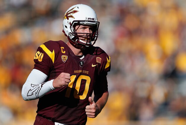 TEMPE, AZ - NOVEMBER 22:  Quarterback Taylor Kelly #10 of the Arizona State Sun Devils reacts after throwing a six yard touchdown reception to tight end Kody Kohl (not pictured) during the fourth quarter of the college football game against the Washington State Cougars at Sun Devil Stadium on November 22, 2014 in Tempe, Arizona.  The Sun Devils defeated the Cougars 52-31.  (Photo by Christian Petersen/Getty Images)