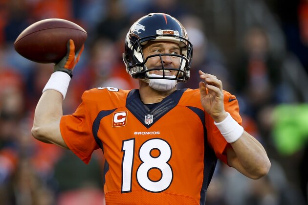 Denver Broncos quarterback Peyton Manning passes against the Buffalo Bills during the second half in an NFL football game Sunday, Dec. 7, 2014, in Denver. (AP Photo/David Zalubowski)