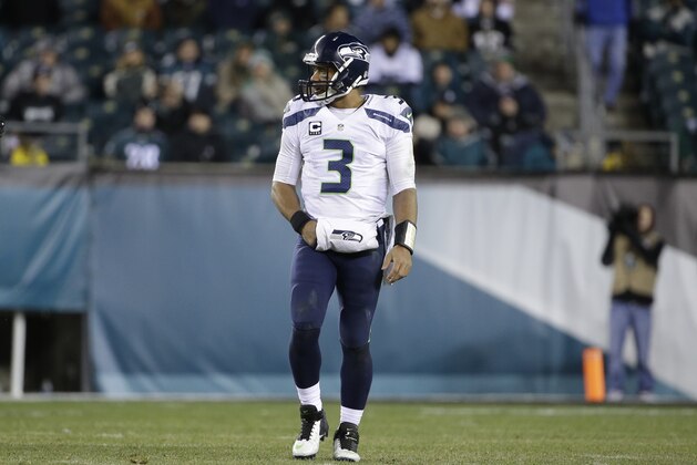 Seattle Seahawks' Russell Wilson walks the field during the second half of an NFL football game against the Philadelphia Eagles, Sunday, Dec. 7, 2014, in Philadelphia. (AP Photo/Matt Rourke)