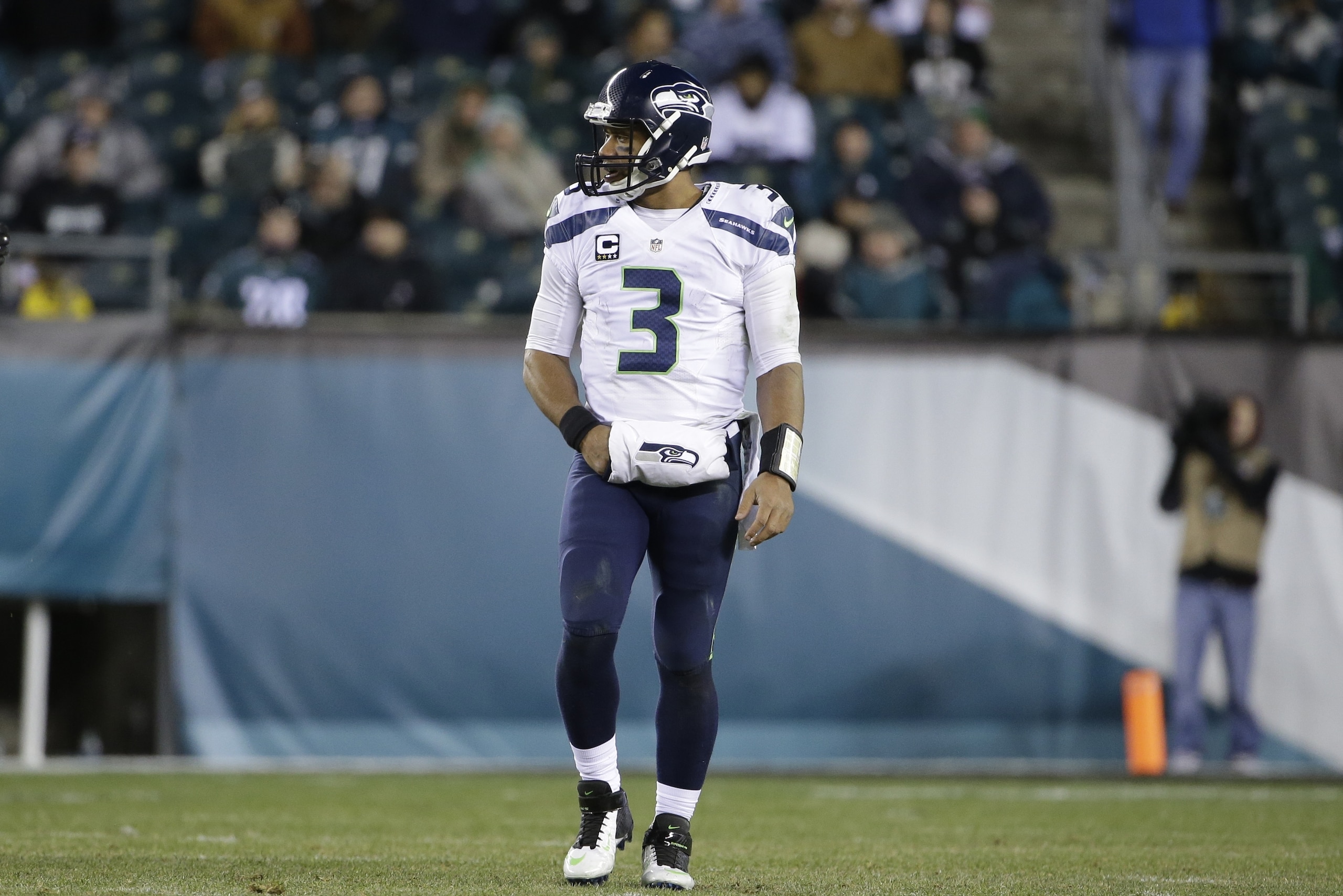 Seattle Seahawks' Russell Wilson walks the field during the second half of an NFL football game against the Philadelphia Eagles, Sunday, Dec. 7, 2014, in Philadelphia. (AP Photo/Matt Rourke)