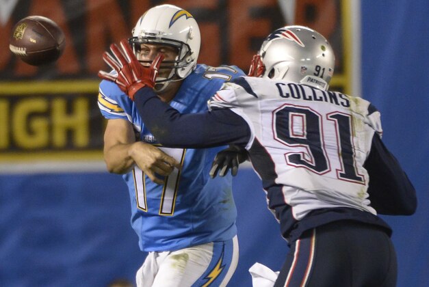 Dec 7, 2014; San Diego, CA, USA; San Diego Chargers quarterback Philip Rivers (17) throws as New England Patriots outside linebacker Jamie Collins (91) defends during first half action at Qualcomm Stadium. Mandatory Credit: Robert Hanashiro-USA TODAY Sports