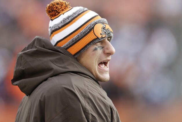 Cleveland Browns quarterback Johnny Manziel watches from the sidelines in the third quarter of an NFL football game against the Indianapolis Colts Sunday, Dec. 7, 2014, in Cleveland. (AP Photo/Tony Dejak)