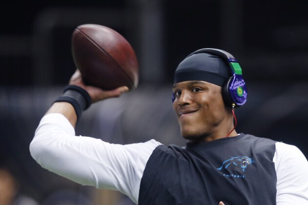 Carolina Panthers quarterback Cam Newton warms up before an NFL football game against the New Orleans Saints in New Orleans, Sunday, Dec. 7, 2014. (AP Photo/Bill Haber)