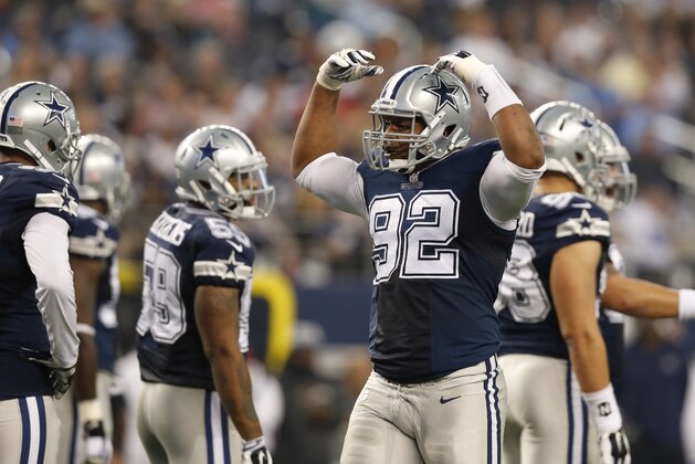 Nov 27, 2014; Arlington, TX, USA; Dallas Cowboys defensive end Jeremy Mincey (92) motions to get the crowd loader against the Philadelphia Eagles at AT&T Stadium. Mandatory Credit: Matthew Emmons-USA TODAY Sports