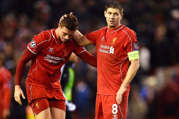 LIVERPOOL, ENGLAND - DECEMBER 09:  (L-R) Dejected Liverpool players Jordan Henderson and Steven Gerrard react following their team's 1-1 draw and exit from the competition during the UEFA Champions League group B match between Liverpool and FC Basel 1893 at Anfield on December 9, 2014 in Liverpool, United Kingdom.  (Photo by Laurence Griffiths/Getty Images)
