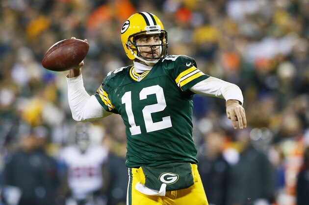 GREEN BAY, WI - DECEMBER 08:   Aaron Rodgers #12 of the Green Bay Packers looks to pass in the third quarter against the Atlanta Falcons at Lambeau Field on December 8, 2014 in Green Bay, Wisconsin.  (Photo by Kevin C. Cox/Getty Images)