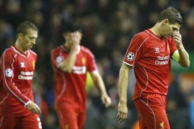 Liverpool's Steven Gerrard, right, leaves the field at half time during the Champions League Group B soccer match between Liverpool and FC Basel at Anfield Stadium in Liverpool, England, Tuesday, Dec. 9, 2014. (AP Photo/Jon Super)
