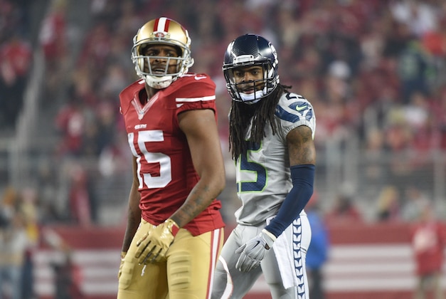 November 27, 2014; Santa Clara, CA, USA; Seattle Seahawks cornerback Richard Sherman (25) looks at San Francisco 49ers wide receiver Michael Crabtree (15) during the third quarter at Levi's Stadium. The Seahawks defeated the 49ers 19-3. Mandatory Credit: Kyle Terada-USA TODAY Sports