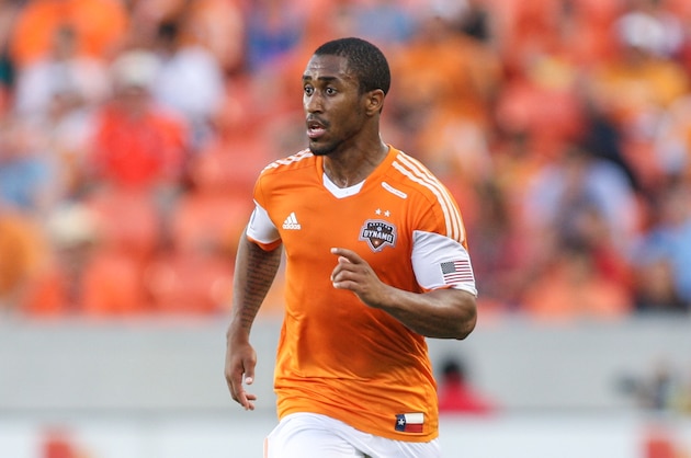 May 11, 2014; Houston, TX, USA; Houston Dynamo midfielder Corey Ashe (26) controls the ball during the second half against Real Salt Lake at BBVA Compass Stadium. Mandatory Credit: Troy Taormina-USA TODAY Sports
