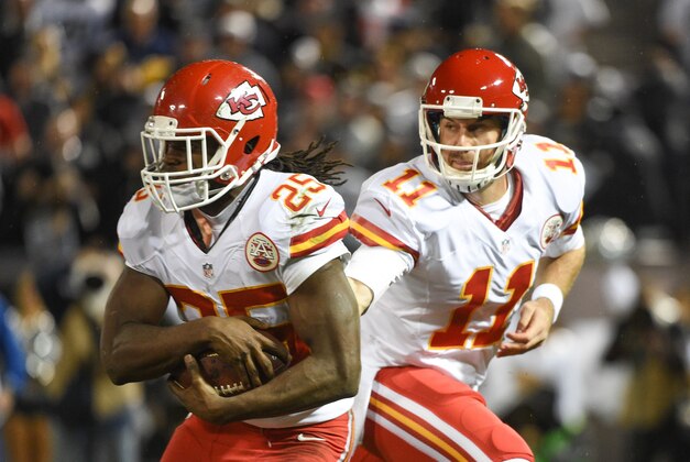 November 20, 2014; Oakland, CA, USA; Kansas City Chiefs running back Jamaal Charles (25) receives the handoff from quarterback Alex Smith (11) during the first quarter against the Oakland Raiders at O.co Coliseum. The Raiders defeated the Chiefs 24-20. Mandatory Credit: Kyle Terada-USA TODAY Sports