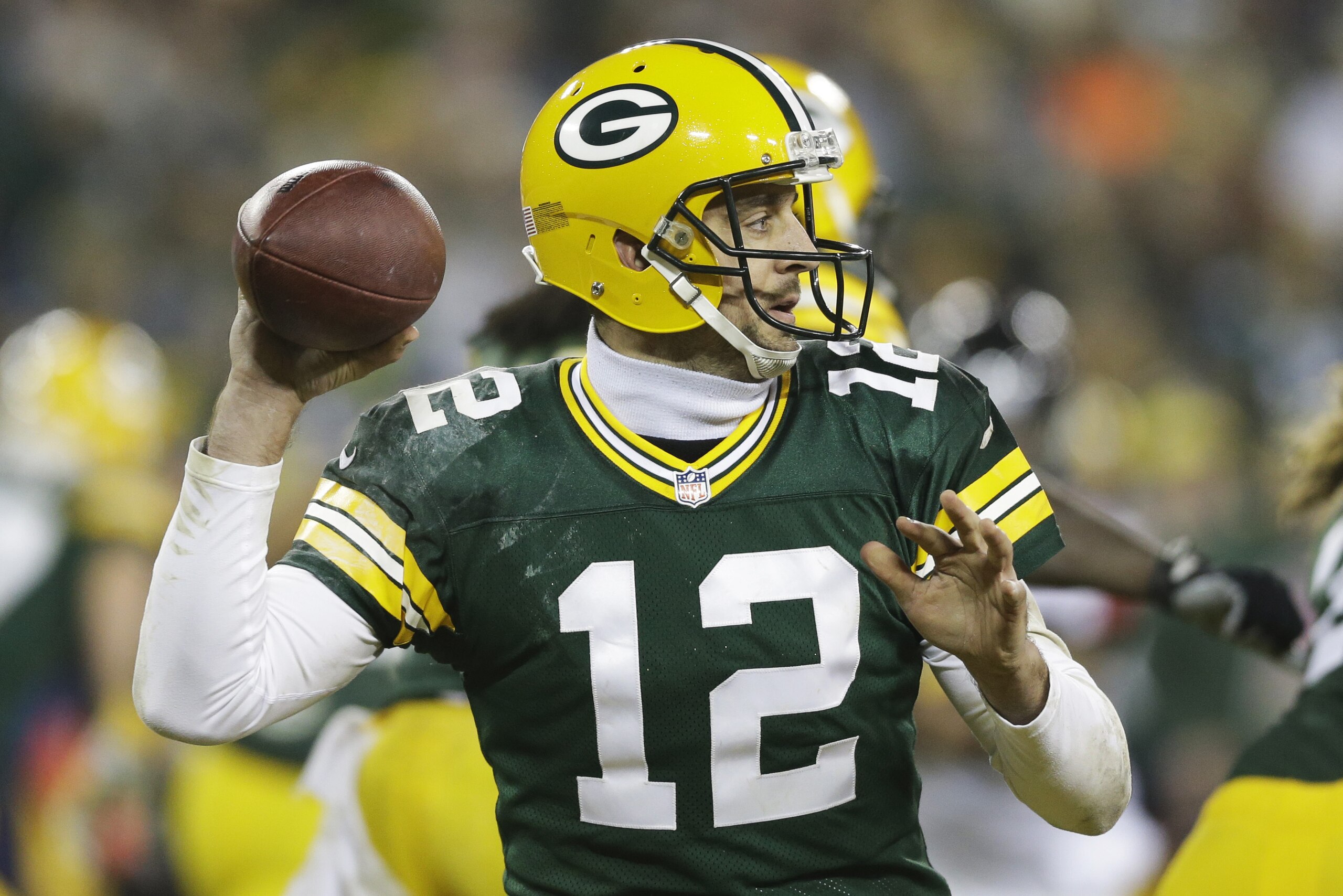 Green Bay Packers' Aaron Rodgers drops back to pass during the second half of an NFL football game against the Atlanta Falcons Monday, Dec. 8, 2014, in Green Bay, Wis. (AP Photo/Tom Lynn)