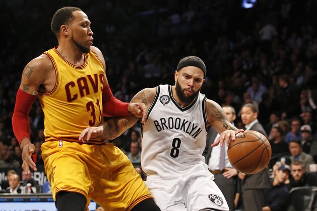 Cleveland Cavaliers guard Shawn Marion, left, defends Brooklyn Nets guard Deron Williams (8) in the second half of an NBA basketball game at the Barclays Center, Monday, Dec. 8, 2014, in New York. The Cavaliers defeated the Brooklyn Nets 110-88. (AP Photo/Kathy Willens)