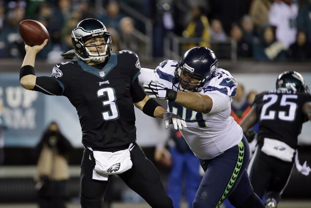Philadelphia Eagles' Mark Sanchez looks to pass during the second half of an NFL football game against the Seattle Seahawks, Sunday, Dec. 7, 2014, in Philadelphia. (AP Photo/Michael Perez)