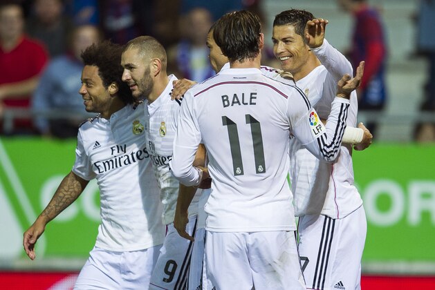 EIBAR, SPAIN - NOVEMBER 22:  Cristiano Ronaldo (R) of Real Madrid celebrates after scoring during the La Liga match between SD Eibar and Real Madrid at Ipurua Municipal Stadium on November 22, 2014 in Eibar, Spain.  (Photo by Juan Manuel Serrano Arce/Getty Images)