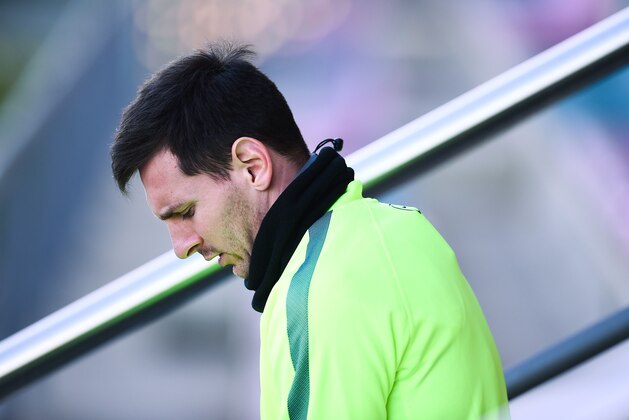 BARCELONA, SPAIN - DECEMBER 09:  Lionel Messi of FC Barcelona looks on during a training session ahead of their UEFA Champions League Group F match against Paris Saint-Germain FC at Ciutat Esportiva on December 9, 2014 in Barcelona, Spain.  (Photo by David Ramos/Getty Images)