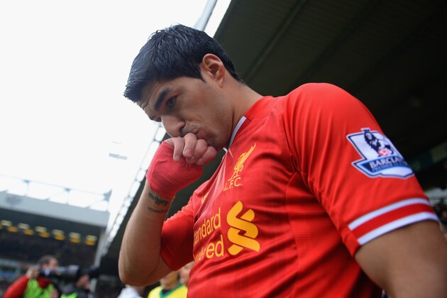 NORWICH, ENGLAND - APRIL 20:  Luis Suarez of Liverpool kisses his hand as he walks out during the Barclays Premier League match between Norwich City and Liverpool at Carrow Road on April 20, 2014 in Norwich, England.  (Photo by Michael Regan/Getty Images)