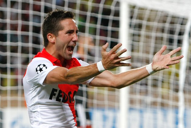Monaco's Joao Moutinho celebrates scoring during the Champions League Group C soccer match between Monaco and Bayer Leverkusen at Louis II stadium in Monaco, Tuesday, Sept. 16, 2014. (AP Photo/Claude Paris)