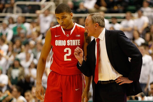 EAST LANSING, MI - JANUARY 07:  Head coach Thad Matta talks with Marc Loving #2 of the Ohio State Buckeyes while playing the Michigan State Spartans at the Jack T. Breslin Student Events Center on January 7, 2014 in East Lansing, Michigan. Michigan State won the game 72-68 in overtime. (Photo by Gregory Shamus/Getty Images)