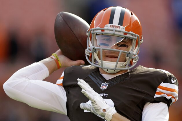 Cleveland Browns quarterback Johnny Manziel warms up before an NFL football game against the Indianapolis Colts Sunday, Dec. 7, 2014, in Cleveland. (AP Photo/Tony Dejak)