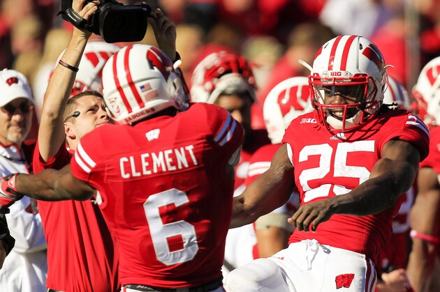 Wisconsin's Corey Clement (6) and Melvin Gordon (25) celebrate Clement's touchdown against Maryland during the second half of an NCAA college football game Saturday, Oct. 25, 2014, in Madison, Wis. Wisconsin won 52-7. (AP Photo/Andy Manis)