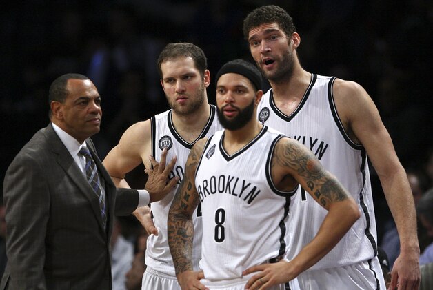 Dec 5, 2014; Brooklyn, NY, USA;   Brooklyn Nets head coach Lionel Hollins talks to guard Bojan Bogdanovic (44) and guard Deron Williams (8) and center Brook Lopez (11) during the first half at Barclays Center. Mandatory Credit: Noah K. Murray-USA TODAY Sports