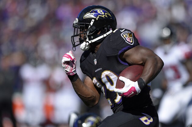 Baltimore Ravens running back Justin Forsett rushes the ball in the first half of an NFL football game against the Atlanta Falcons, Sunday, Oct. 19, 2014, in Baltimore. (AP Photo/Nick Wass)