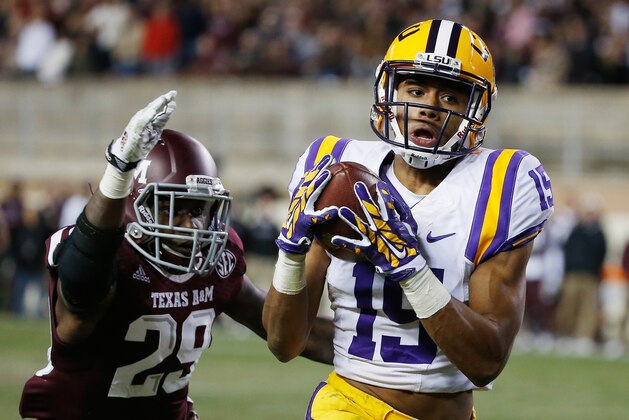 COLLEGE STATION, TX - NOVEMBER 27:  Malachi Dupre #15 of the LSU Tigers hauls in a long pass in front of Deshazor Everett #29 of the Texas A&M Aggies in the second half of their game at Kyle Field on November 27, 2014 in College Station, Texas.  (Photo by Scott Halleran/Getty Images)