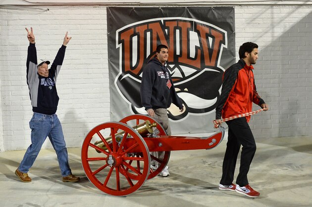 LAS VEGAS, NV - NOVEMBER 29:  UNLV Athletics operations staff members take the Fremont Cannon trophy from the field to the Nevada Wolf Pack locker room late in the team's game against the UNLV Rebels at Sam Boyd Stadium on November 29, 2014 in Las Vegas, Nevada. Nevada won the trophy with a 49-27 victory.  (Photo by Ethan Miller/Getty Images)