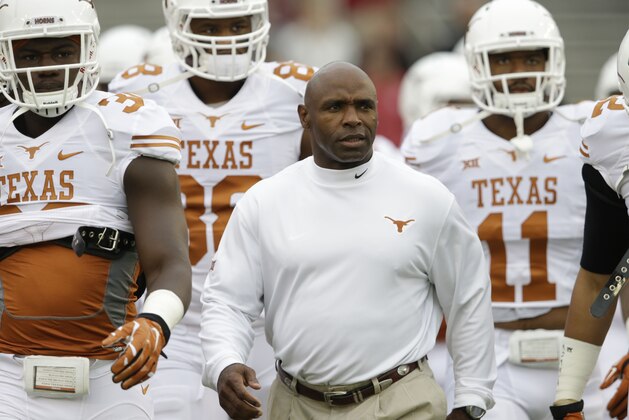 Texas head coach Charlie Strong walks on the field before an NCAA college football game  against Oklahoma at the Cotton Bowl, Saturday, Oct. 11, 2014, in Dallas. (AP Photo/LM Otero)