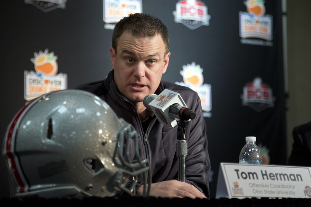 FILE - In this Jan. 3, 2014, file photo, Ohio State offensive coordinator Tom Herman talks to the media during an NCAA college football news conference in Fort Lauderdale, Fla. Herman was named the winner of the Broyles Award on Tuesday, Dec. 9, 2014, after the Buckeyes made the College Football Playoff despite losing two starting quarterbacks to season-ending injuries. (AP Photo/J Pat Carter, File)