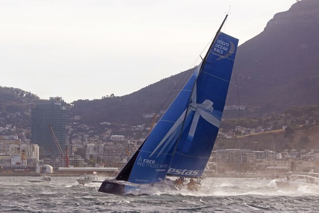 Team Vestas Wind departs on the next leg of the Volvo Ocean Race from the harbor in Cape Town, South Africa, Wednesday, Nov. 19, 2014. Boats in the Volvo Ocean Race fleet headed for one of the most testing legs of the event between South Africa and Abu Dhabi on Wednesday with the threat of tropical storms awaiting them in the Indian Ocean. (AP Photo/Schalk van Zuydam)