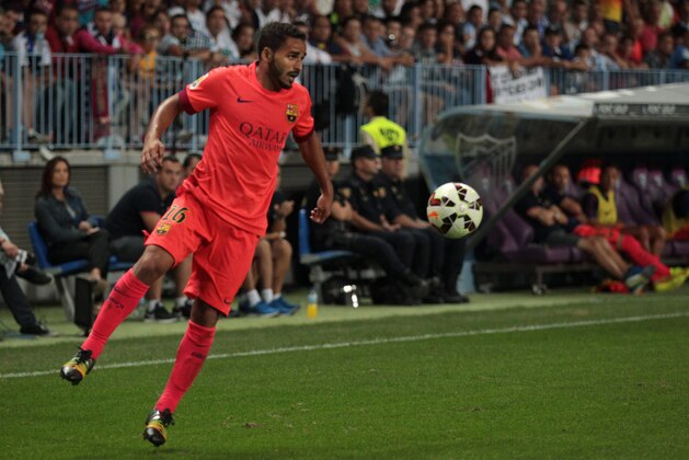 MALAGA, SPAIN - SEPTEMBER 24:  Douglas of Barcelona in action during the La Liga match between Malaga CF and FC Barcelona at La Rosaleda studium on September 24, 2014 in Malaga, Spain. (Photo by Sergio Camacho/Getty Images)
