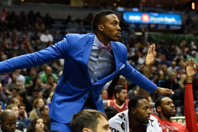 Nov 29, 2014; Milwaukee, WI, USA; Houston Rockets center Dwight Howard (12) reacts from the bench during the game against the Milwaukee Bucks in the fourth quarter at BMO Harris Bradley Center. Mandatory Credit: Benny Sieu-USA TODAY Sports