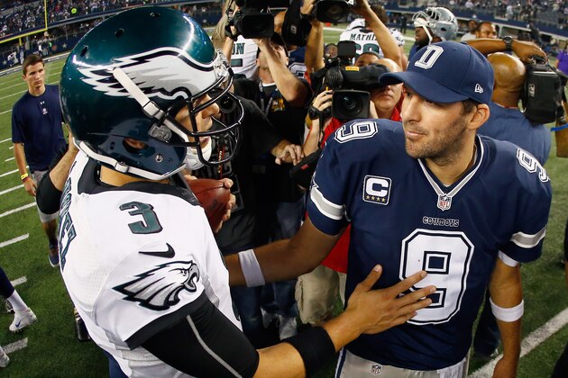 ARLINGTON, TX - NOVEMBER 27: Quarterback Tony Romo #9 of the Dallas Cowboys talks with quarterback Mark Sanchez #3 of the Philadelphia Eagles after the Eagles beat the Cowboys 33-10 at AT&T Stadium on November 27, 2014 in Arlington, Texas.  (Photo by Tom Pennington/Getty Images)