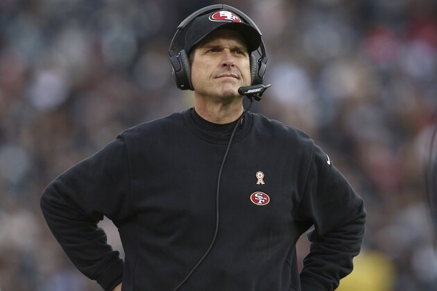 San Francisco 49ers head coach Jim Harbaugh stands on the sideline during the second half of an NFL football game against the Oakland Raiders in Oakland, Calif., Sunday, Dec. 7, 2014. The Raiders won 24-13. (AP Photo/Ryan Kang)