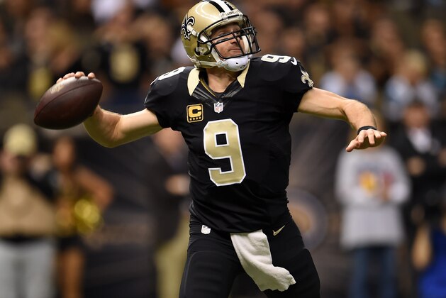NEW ORLEANS, LA - DECEMBER 07:   Drew Brees #9 of the New Orleans Saints throws a pass during the first quarter against the Carolina Panthers  at Mercedes-Benz Superdome on December 7, 2014 in New Orleans, Louisiana.  (Photo by Stacy Revere/Getty Images)