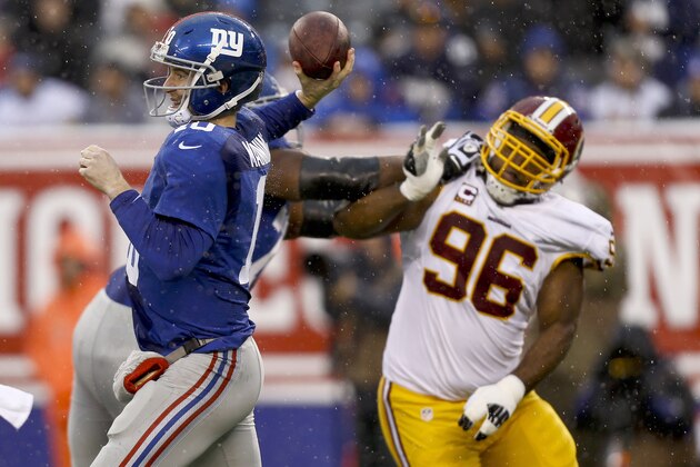 EAST RUTHERFORD, NJ - DECEMBER 29:   Eli Manning #10 of the New York Giants passes against the Washington Redskins during their game at MetLife Stadium on December 29, 2013 in East Rutherford, New Jersey.  (Photo by Jeff Zelevansky/Getty Images)