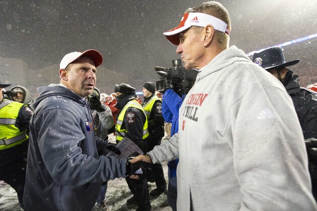 Nov 15, 2014; Madison, WI, USA; Nebraska Cornhuskers head coach Bo Pelini (left) greets Wisconsin Badgers head coach Gary Andersen following the game at Camp Randall Stadium.  Wisconsin won 59-24.  Mandatory Credit: Jeff Hanisch-USA TODAY Sports