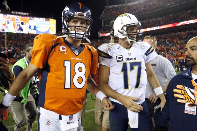 Denver Broncos quarterback Peyton Manning (18) greets San Diego Chargers quarterback Philip Rivers (17) after an NFL football game, Thursday, Oct. 23, 2014, in Denver. The Broncos won 35-21. (AP Photo/Jack Dempsey)