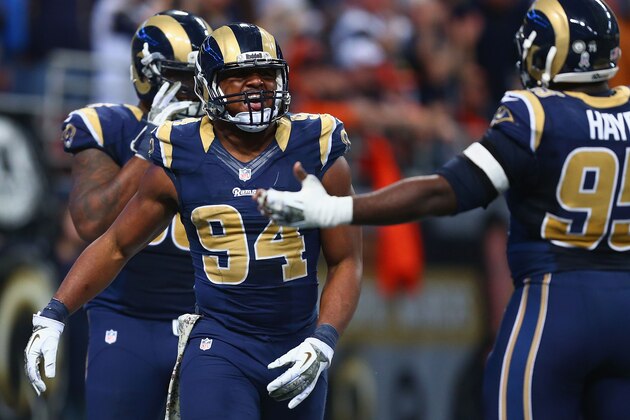 ST. LOUIS, MO - NOVEMBER 24: Robert Quinn #94 of the St. Louis Rams celebrates after returning a fumble for a touchdown against the Chicago Bears at the Edward Jones Dome on November 24, 2013 in St. Louis, Missouri.  The Rams beat the Bears 42-21.  (Photo by Dilip Vishwanat/Getty Images)