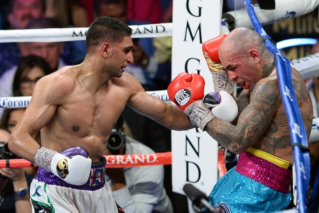 LAS VEGAS, NV - MAY 03:  Amir Khan (L) hits Luis Collazo in the 10th round of their welterweight bout at the MGM Grand Garden Arena on May 3, 2014 in Las Vegas, Nevada. Khan won by unanimous decision.  (Photo by Ethan Miller/Getty Images)