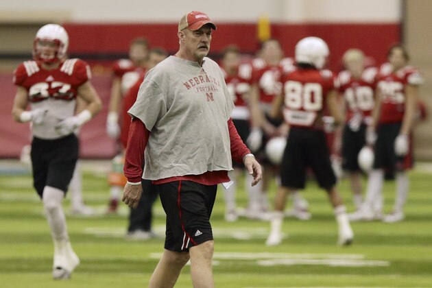Nebraska interim head coach Barney Cotton follows practice in Lincoln, Neb., Wednesday, Dec. 10, 2014. Nebraska begins practicing for the NCAA college football Holiday Bowl against USC with interim coach Barney Cotton in charge. Bo Pelini was fired 10 days ago, and new coach Mike Riley is busy recruiting players and assembling his staff. (AP Photo/Nati Harnik)